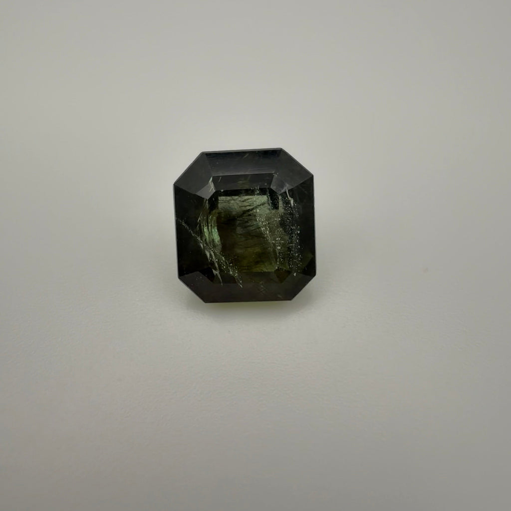 5.115 carat olive rectangle cut tourmaline shown in a top-down macro view