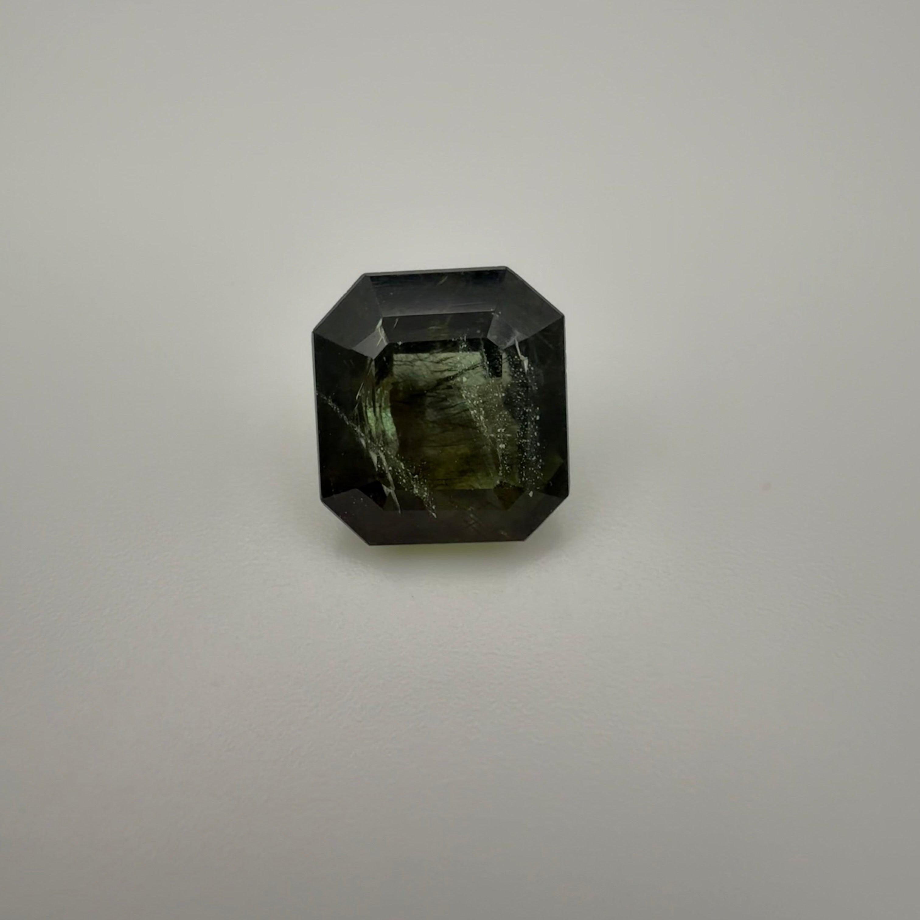 5.115 carat olive rectangle cut tourmaline shown in a top-down macro view