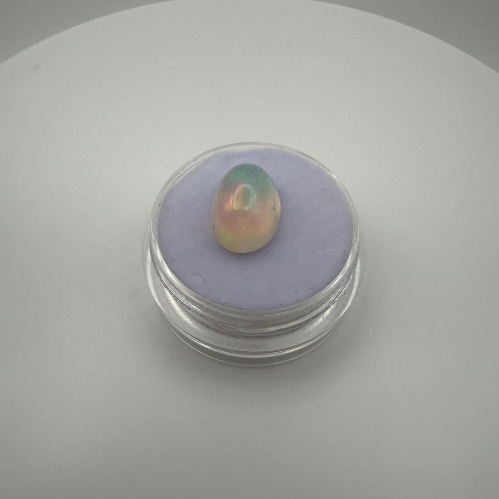 A fiery 3 carat welo opal in a gemstone holder