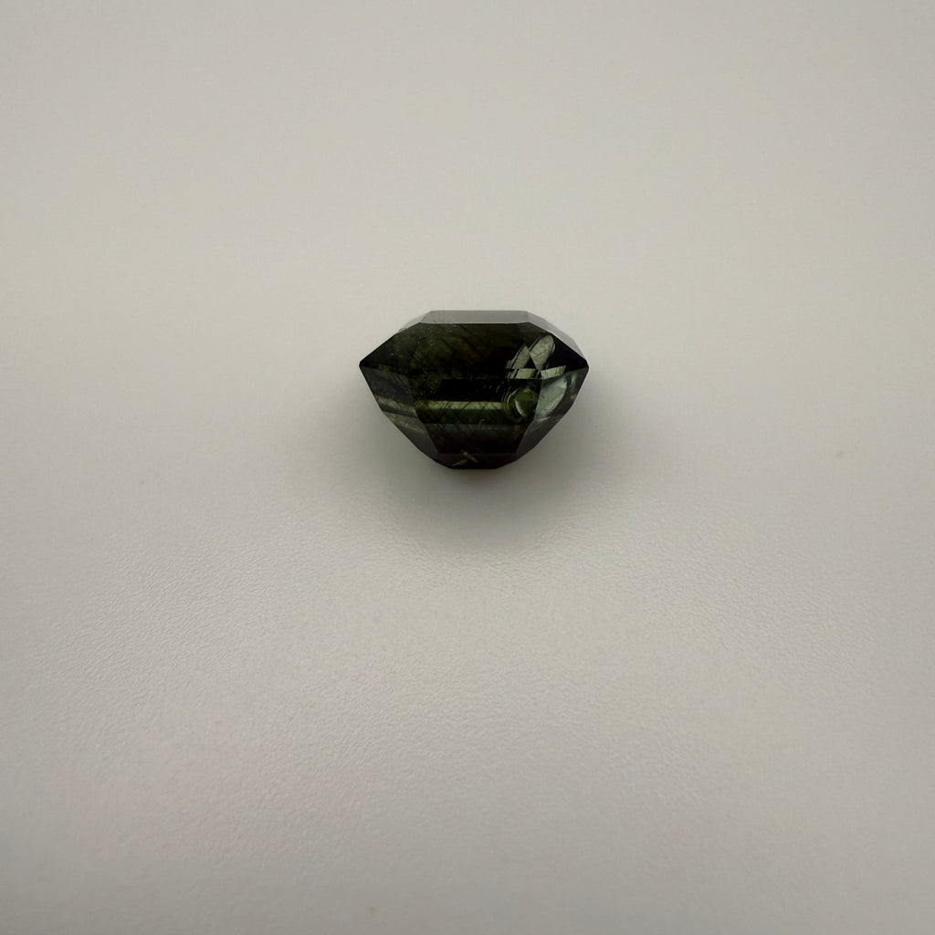 5.115 carat olive rectangle cut tourmaline backside shown in a top-down macro view