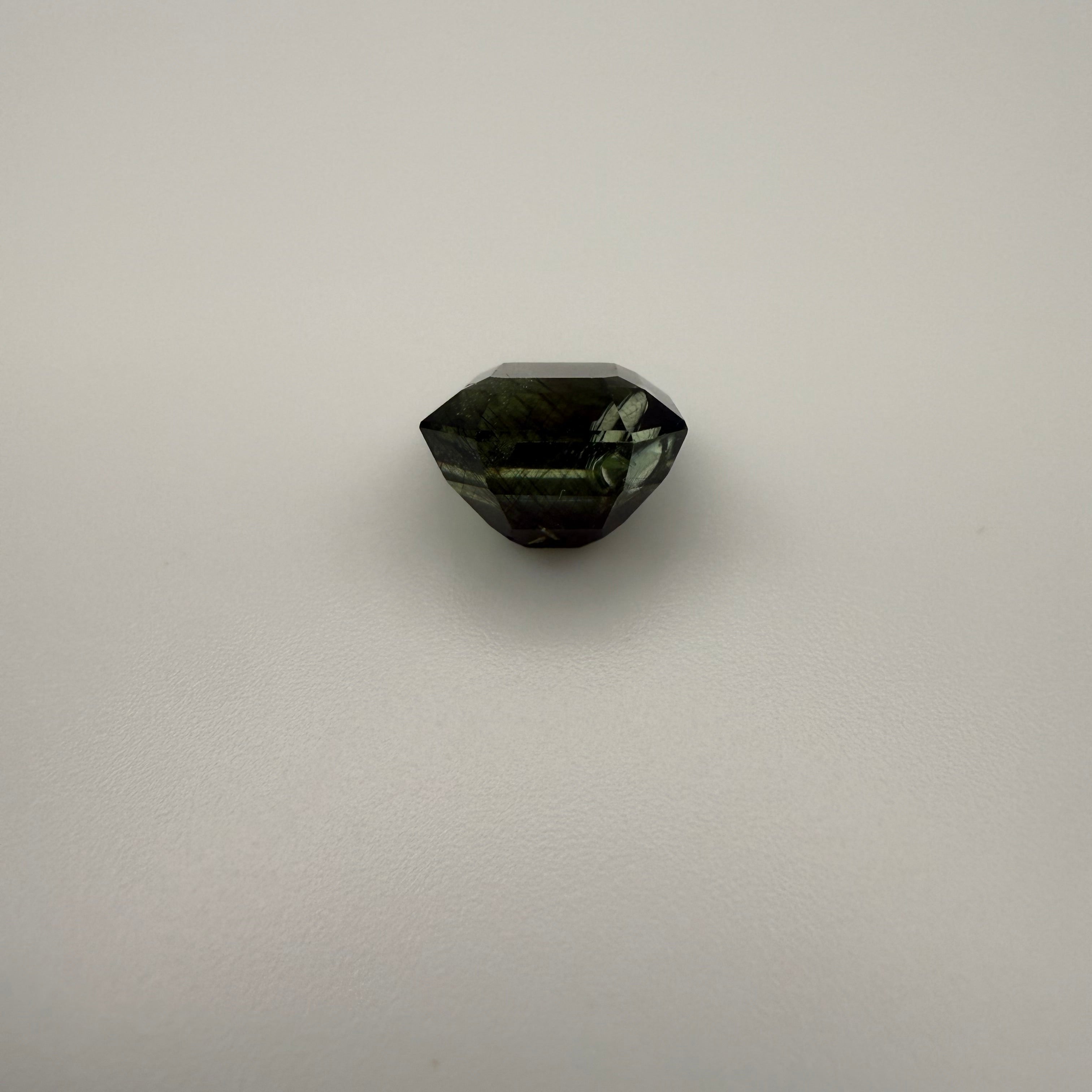 5.115 carat olive rectangle cut tourmaline backside shown in a top-down macro view