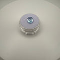 oval faceted 2.05ct Swiss Blue Topaz gemstone on purple velvet in clear gem holder