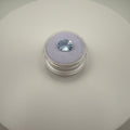 Oval faceted 1.95ct Swiss Blue Topaz gemstone on purple cushion in clear holder