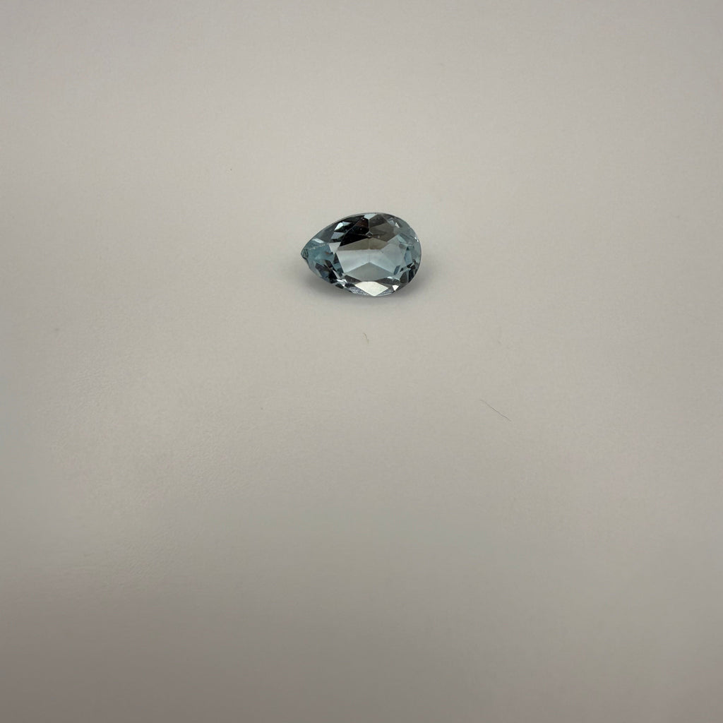 2.25ct Swiss Blue Topaz pear faceted gemstone on a light background