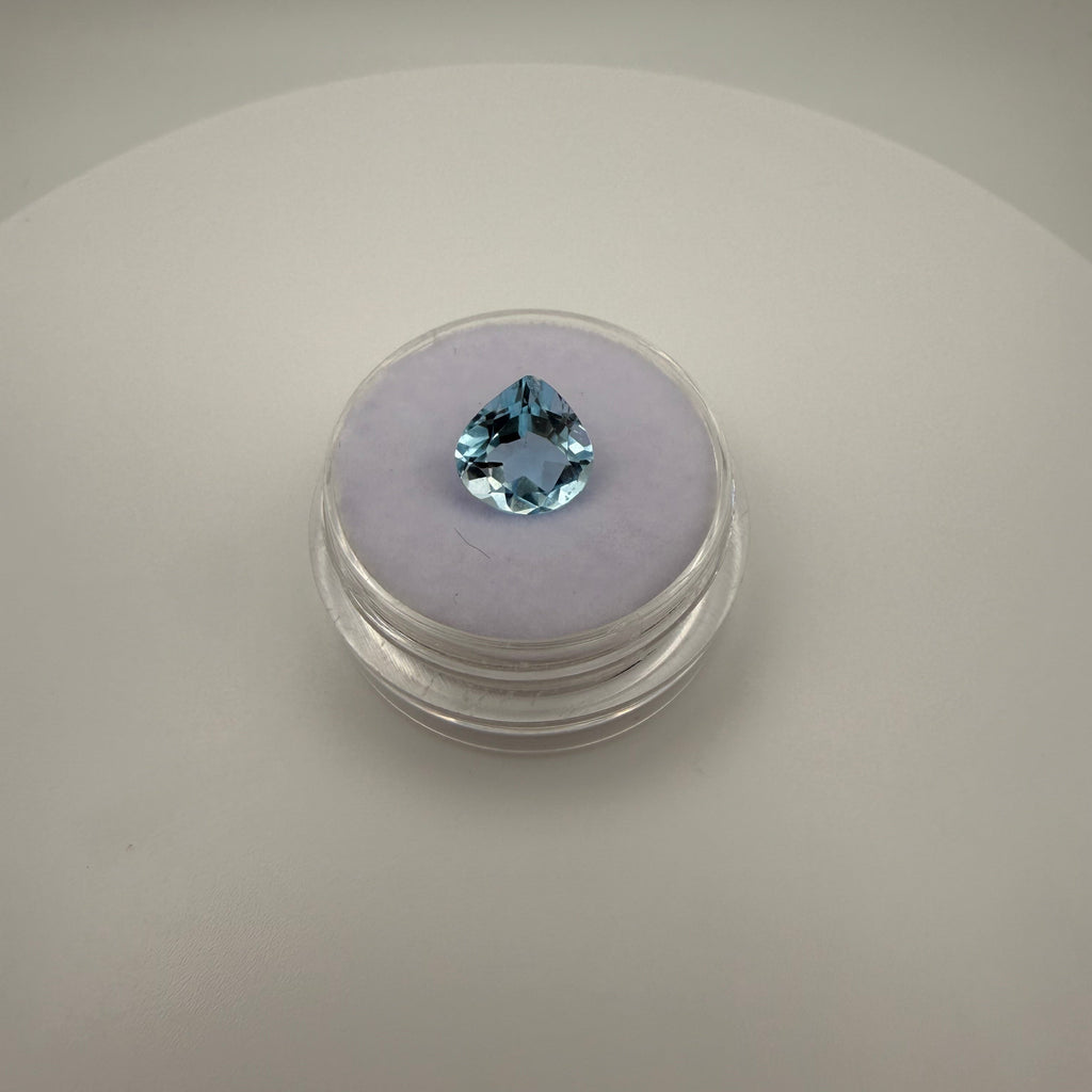 Pear-shaped 2.4ct Swiss Blue Topaz gemstone on a soft holder