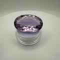 oval faceted 61.6ct Rose de France Amethyst displayed on a clear gem holder